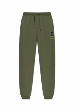 EA7 Emporio Armani ZIELONY Spodnie dresowe z naszywką z logo