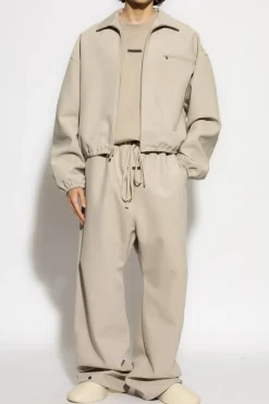 Fear Of God Essentials beżowy T-shirt z logo